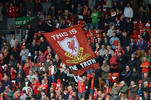 A banner praising the findings of a recent report into the Hillsborough disaster is unfurled by Liverpool supporters