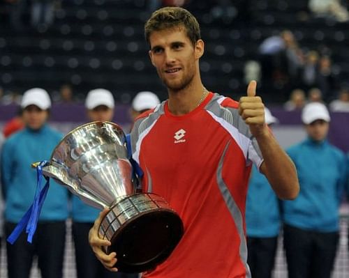 Martin Klizan celebrates with his trophy