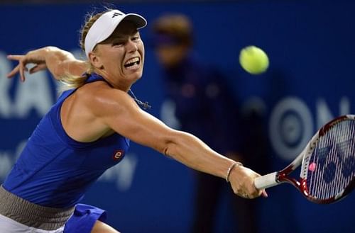 Caroline Wozniacki made it into the last eight by beating Li Na