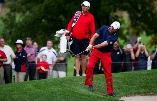 Phil Mickelson of the US swings from the rough off the 3rd fairway