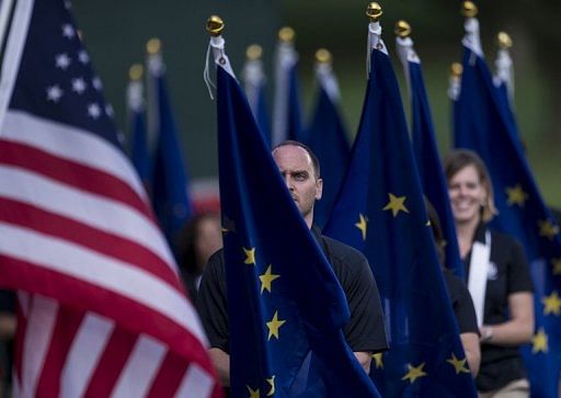 The American and European Union flags are carried during the opening ceremony