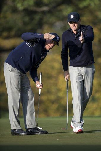 Team USA&#039;s Phil Mickelson (L) and Keegan Bradley line up a put on the 3rd hole&#039;s green