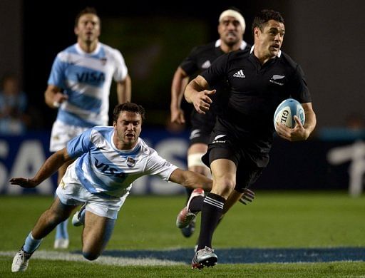 New Zealand&#039;s All Blacks fly half Dan Carter (R) slotted three conversions and two penalties