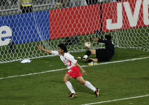 Jung Hwan Ahn of South Korea heads the winning goal past goalkeeper Gianluigi Buffon of Italy