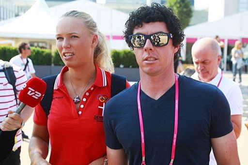 Caroline Wozniacki of Denmark and Rory McIlroy, pictured in July