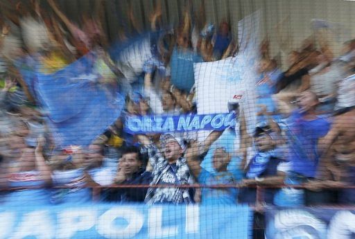 Napoli supporters cheer their team before their Serie A match against Sampdoria