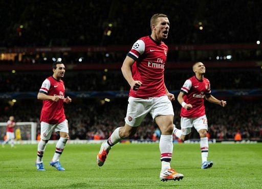 Podolski sinks Olympiakos as Arsenal bounce back