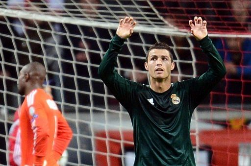 Real, Malaga coast to Champions League victories