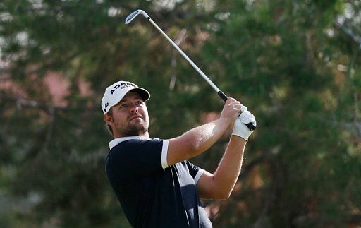 American Ryan Moore equalled the course record and his career best with a 10-under 61 to lead the field