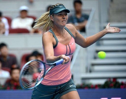 Russia&#039;s Maria Sharapova cruised into the final with a comfortable 6-4, 6-0 win over her Chinese rival
