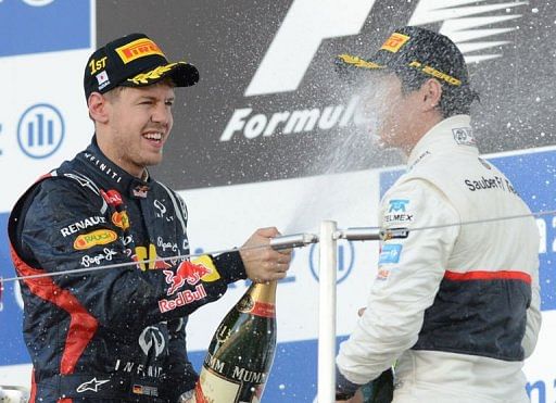 Vettel (left) became the first man this year to score back-to-back wins after a victory in Singapore