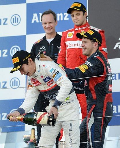Kobayashi (front) became only the third Japanese driver to score a podium finish in Formula One