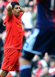 Liverpool's Luis Suarez reacts to a missed chance