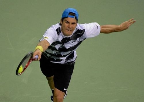 Tommy Haas of Germany returns against Nicolas Almagro of Spain