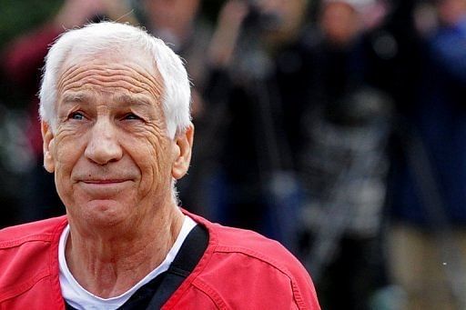 Former Penn State assistant football coach Jerry Sandusky walks into the Centre County Courthouse