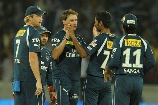 Deccan Chargers bowler Dale Steyn (3rd left) celebrates a wicket with teammates during an IPL game in May