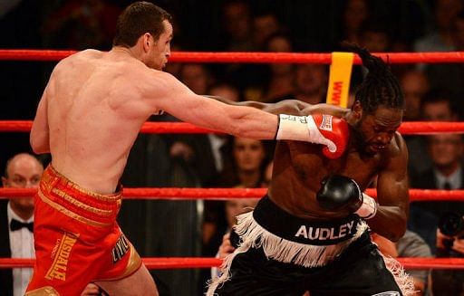 David Price (L) lands a punch on Audley Harrison