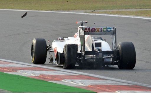 Japanese Sauber-Ferrari driver Kamui Kobayashi steers his car with a flat tyre during the Korean F1 Grand Prix