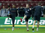 England's defender Ashley Cole (left) and forward Wayne Rooney (C) take part in a trainning session