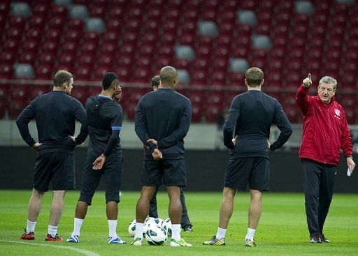England coach Roy Hodgson (right) oversees a training session at the National Stadium in Warsaw