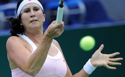 Sweden&#039;s Sofia Arvidsson returns a ball to France&#039;s Marion Bartoli