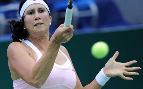 Sweden's Sofia Arvidsson returns a ball to France's Marion Bartoli