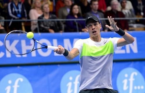 Czech Republic's Thomas Berdych returns the ball to France's Jo-Wilfried Tsonga