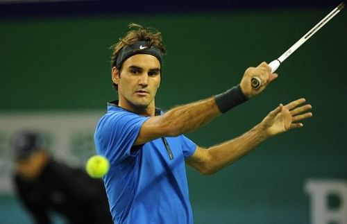 Roger Federer hits a return to Andy Murray in their semi-final match of the Shanghai Masters, on October 13