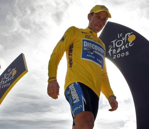 Lance Armstrong standing on the winners&#039; podium after the 92nd Tour de France in 2005