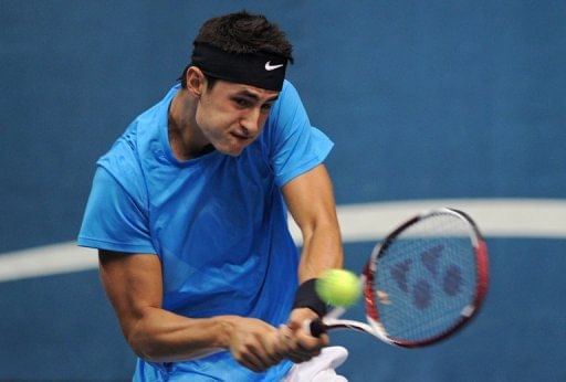 Tomic thrashed but Ebden wins for Australia