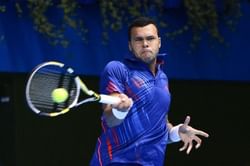 Tsonga hit by back injury
