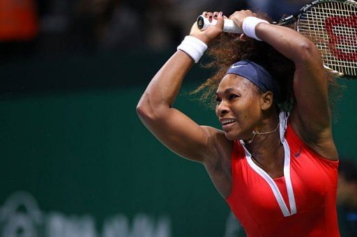 Serena Williams of the USA returns the ball to Li Na of China