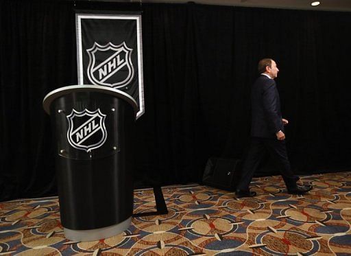 Commissioner Gary Bettman of the National Hockey League leaves the podium after addressing the media in September
