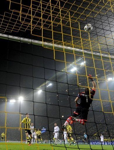 Dortmund&#039;s Robert Lewandowski has an attempt on goal pushed over by Real Madrid&#039;s goalkeeper Iker Casillas
