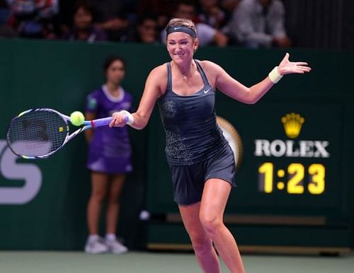 Victoria Azarenka of Belarus returns the ball to Angelique Kerber of Germany