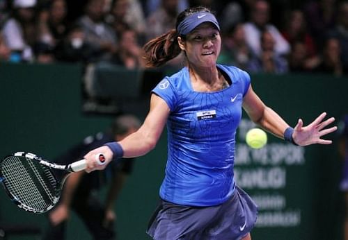 Li Na of China returns the ball to Angelique Kerber of Germany