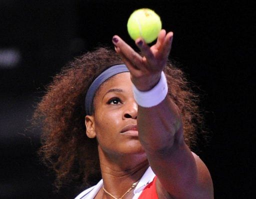 Serena Williams of USA serves to Victoria Azarenka of Belarus