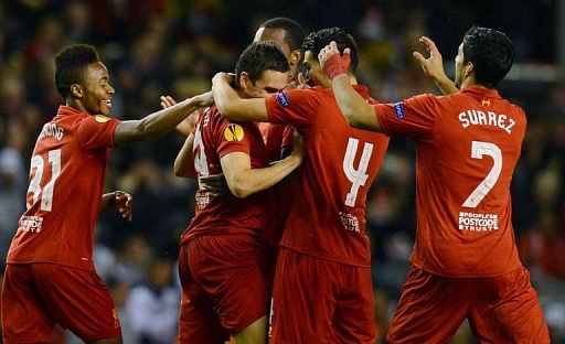 Liverpool&#039;s Stewart Downing (2nd L) celebrates with teammates after scoring