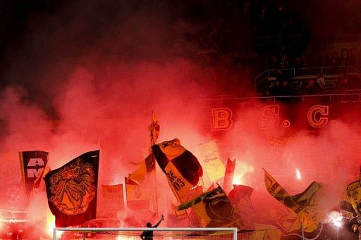 Young Boys fans light flares prior to the match