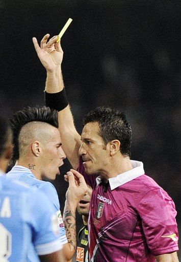 Napoli&#039;s midfielder Marek Hamsik (L) is known for his lively style as much for his distinctive Mohican-style haircut