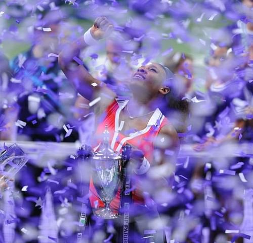 Serena Williams holds the trophy