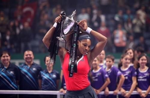 Serena Williams of the United States holds the trophy after winning the final of the WTA Championships