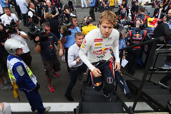 F1 rivals hail Vettel hat?trick