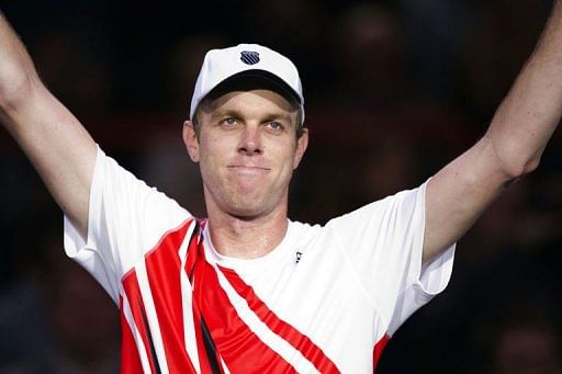 Sam Querrey celebrates after defeating Novak Djokovic