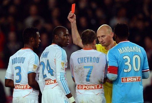 PSG beat 10-man Marseille to reach last eight
