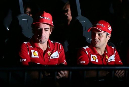 Ferrari&#039;s Fernando Alonso (L) and Felipe Massa