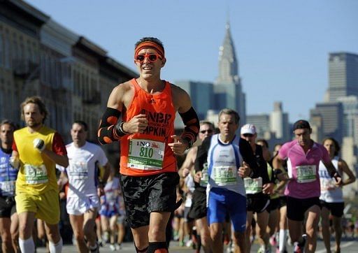 Runners make their way through Queens during the 2011 New York City Marathon