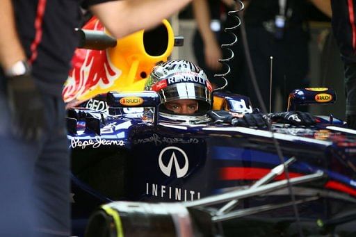 Red Bull Racing&#039;s German driver Sebastian Vettel sits in the pits
