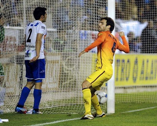 Barcelona&#039;s midfielder Cesc Fabregas celebrates after scoring