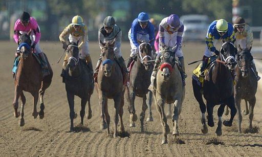 Jockey Rosie Napravnik on Shanghai Bobby (R) fights for a victory against Mario Gutierez on He&#039;s Had Enough (2ndR)